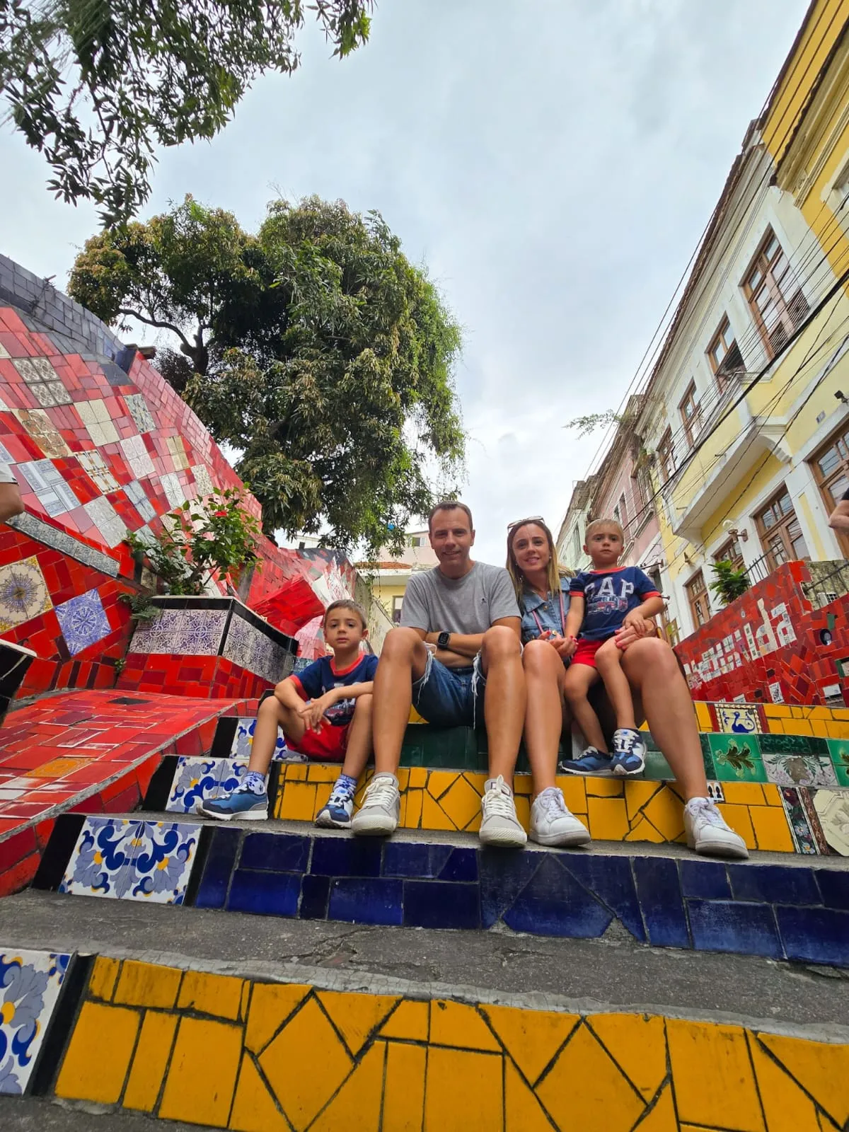 Visitors seated on the colorful Selarón Steps in Rio de Janeiro