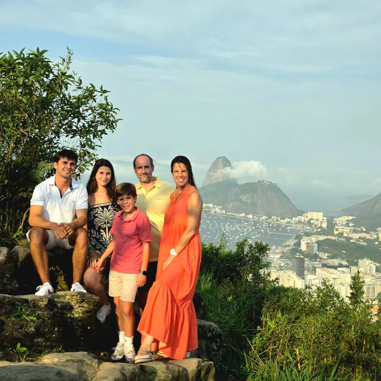 Visitors at a viewpoint with Sugarloaf Mountain and Guanabara Bay in the background